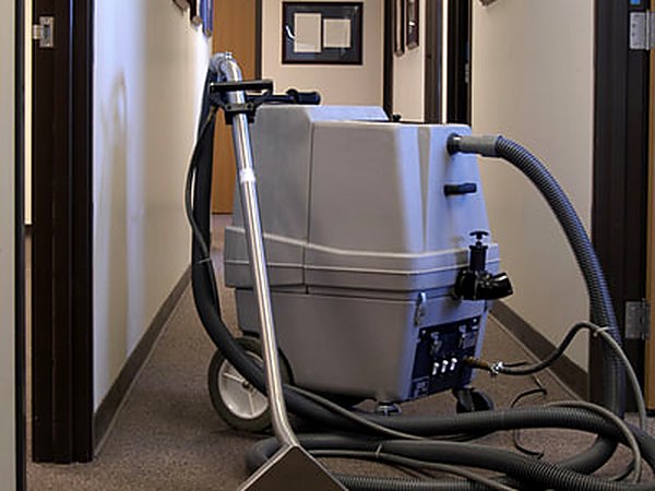 Carpet extractor working a facility corridor after hours in Mesa AZ