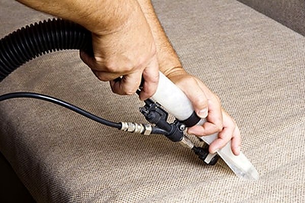 Low-moisture extraction cleaning bedding fabric in a Mesa AZ home